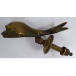 A late Victorian cast brass novelty door knocker, fashioned as a fish,