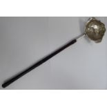 A Georgian silver toddy ladle, the oval bowl with a cut, flared rim and embossed ornament,