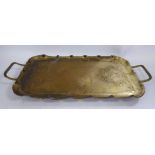 An early 20thC Art Nouveau JS&S brass tray with wire loop handles and a crimped border,