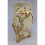 A Clarice Cliff cream glazed china vase of ovoid form, having a flared rim,