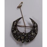 A Victorian gold coloured and oxidised silver coloured metal crescent brooch,