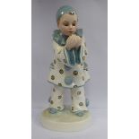A 1930s Goldscheider Lavergue pottery figure 'Pierrot with a Cigarette' wearing a spotted white and