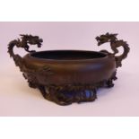 A late 19thC Japanese cast and patinated bronze bowl of shallow, bulbous form,