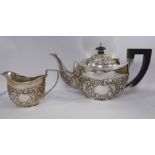 A late Victorian bachelor's silver teapot of oval form, having a swept spout,