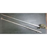 A French cavalry sword with a brass basket hilt and wire bound handgrip,