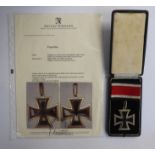A German Knight's Cross 1939 (copy case and ribbon) and an accompanying certificate of authenticity