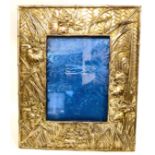 An early 20thC Japanese white metal photograph frame, cast and chased with simulated bamboo,
