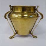 An Arts & Crafts Soutterware brass jardiniere of tapered form with an upstand rim,