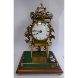 A 20thC Spherical Weight Clock in lacquered brass with stainless steel spheres,