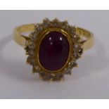 An 18ct gold ring, set with an oval ruby,