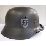 A German SS helmet with two decals,