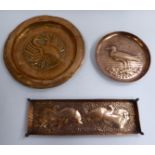 An early 20thC embossed and chased copper dish featuring a standing gull impressed Newlyn 5''dia;