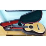 A small Spanish six string acoustic guitar,