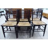 A set of six 19thC turned and stained oak framed dining chairs with level, ring turned,