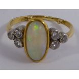 An 18ct gold ring, set with an oval opal,