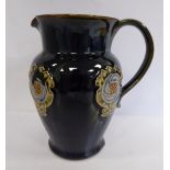 A Royal Doulton streaky blue, green and brown glazed stoneware jug of baluster form, having a wide,
