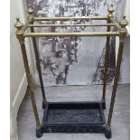 A late Victorian tubular brass and black painted cast iron stickstand with eight divisions,