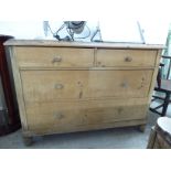 A mid 20thC re-claimed waxed pine chest with a planked top, over two short/two long drawers,