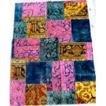 A patchwork design rug on a multi-coloured ground 47'' x 76'' CA