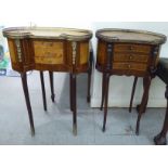 Two similar mid/late 20thC French walnut and mahogany kidney shaped side tables with brass mounts