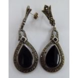 A pair of 'vintage' pendant earrings with a teardrop design onyx tablet,