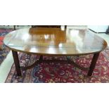 A modern mahogany coffee table with a butler's tray top,