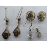 Three pairs of silver earrings various forms 11