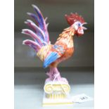 A Nymphenburg porcelain model, a cockerel standing on a Corinthian capital 5.