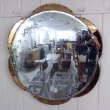 A 1950s bevelled and engraved mirror with bronze coloured crescent border slips 23''dia BSR