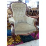 A late Victorian mahogany framed salon chair with a button upholstered green fabric back and