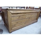 A modern re-claimed boarded and panelled pine chest with straight sides and a hinged lid 23''h