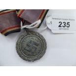 A World War II German Luftschutz medal, 2nd Class, inscribed 1938 on the obverse,