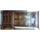 A modern Georgian style mahogany cabinet bookcase,