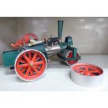 A mid 20thC green painted metal model steamroller 7''h OS1