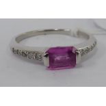 An 18ct white gold ring, set with a pink sapphire,