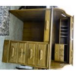 A modern reproduction of an early 20thC light oak rolltop desk,