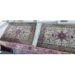 Two similar Persian design rugs on multi-coloured grounds both 43'' x 66'' S