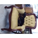 A modern reproduction of a Victorian mahogany showwood framed grandfather chair with enclosed arms,