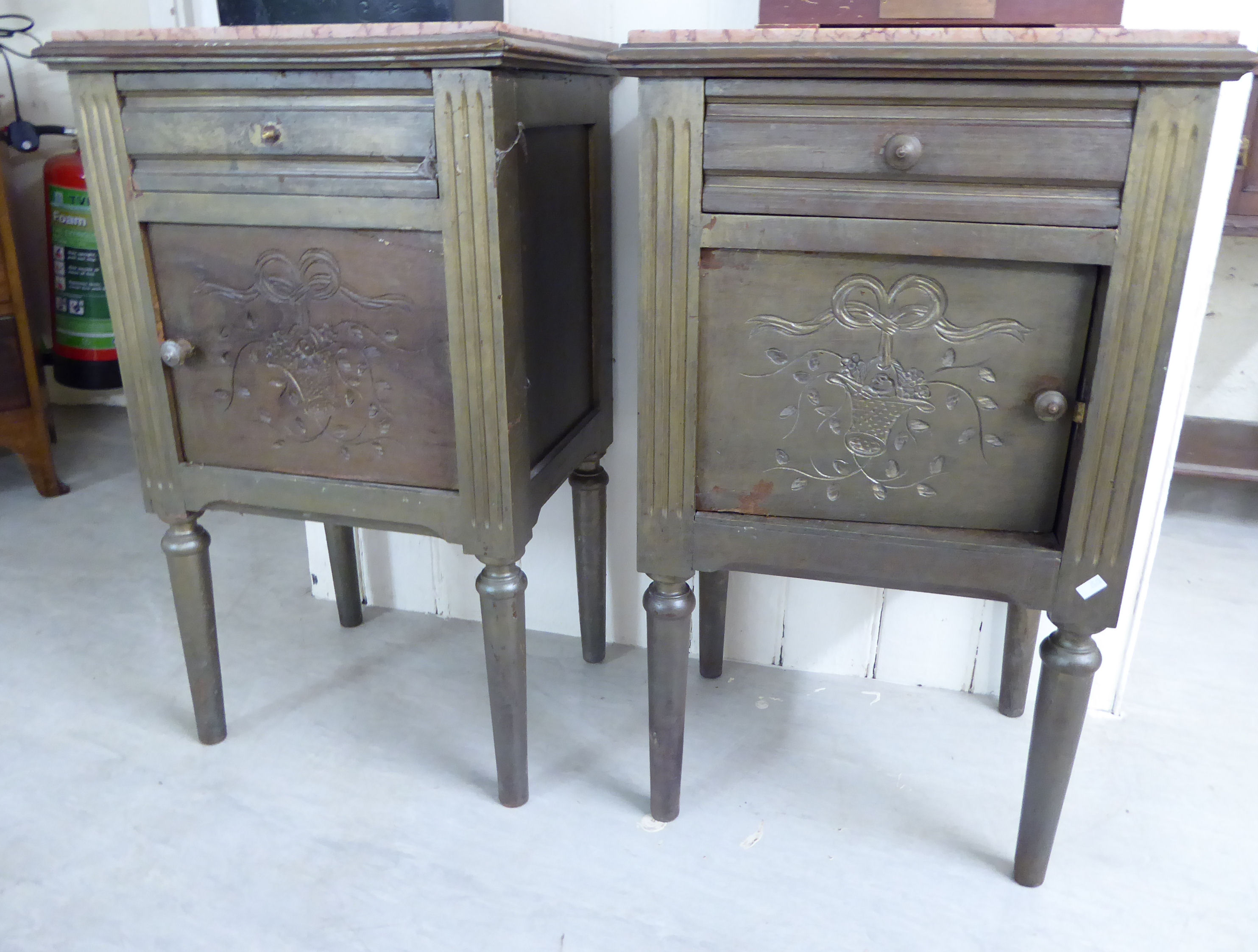 A pair of mid 20thC Continental style green painted pine bedside cabinets,