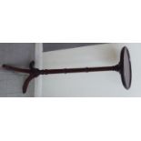 A modern Georgian style mahogany torchere,