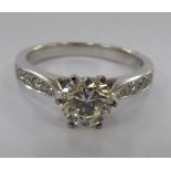 An 18ct white gold natural yellow diamond solitaire ring with EDR certificate 11