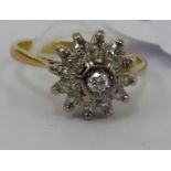 An 18ct gold diamond cluster ring 11