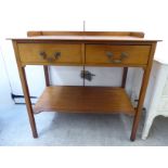 An early 20thC mahogany washstand with a low galleried back and two in-line drawers,
