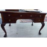 A mid 20thC Georgian style mahogany four drawer kneehole writing desk,