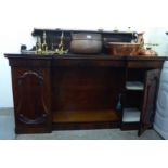 A William IV rosewood chiffonier with a panelled upstand and brass gallery,