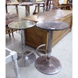 A pair of modern chromium plated steel bar stools with height adjustable, moulded,