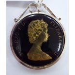 A Commemorative enamel pendant,