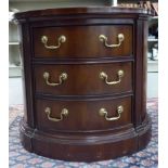 A modern Regency inspired mahogany, oval outlined chest,