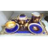 A Czechoslovakian gilded and over painted porcelain cabaret set,