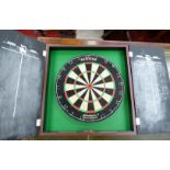 A Supabull II dart board,